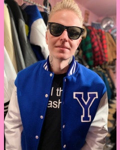 Blue baseball jacket with white leather sleeves